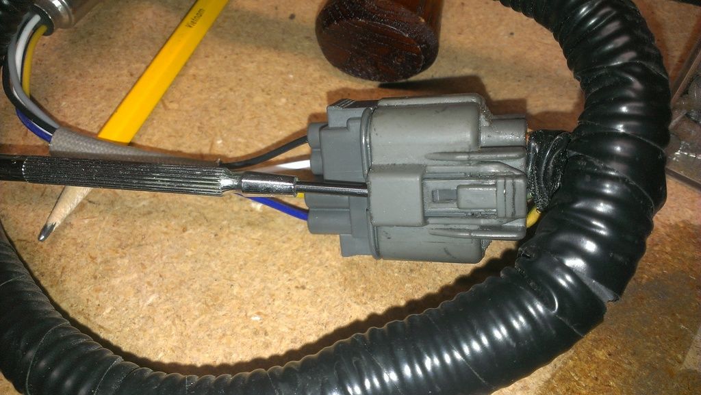 O2 sensor removal I can't get the wiring connector loose. Honda